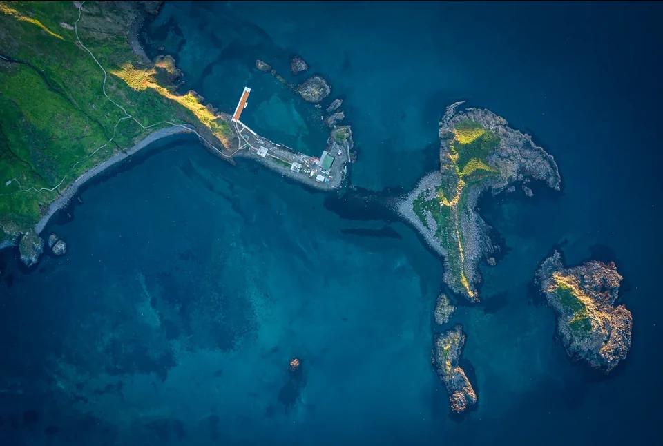 Moneron Island from above — volcanic stacks rising straight out of the Tatar Strait