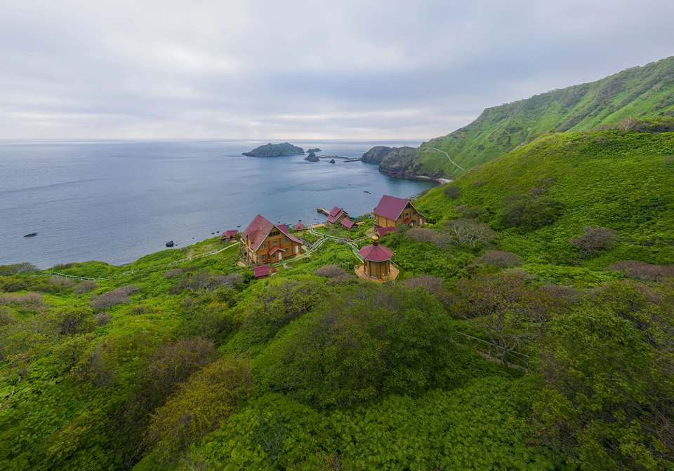 Guest cottages on Moneron's green slopes overlooking the bay and the Tatar Strait