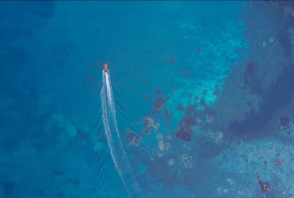 A launch by Moneron's shore — passengers transferring from ship to island