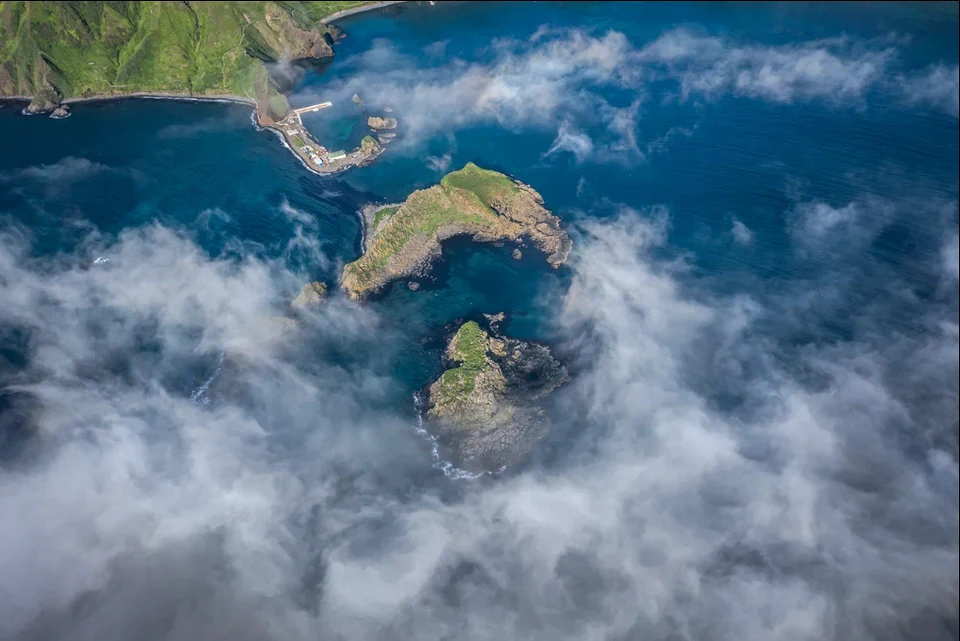 Moneron wrapped in morning mist — the classic early-season weather